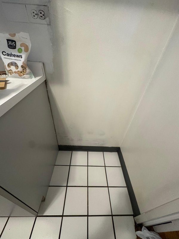 Behind appliance after cleaning